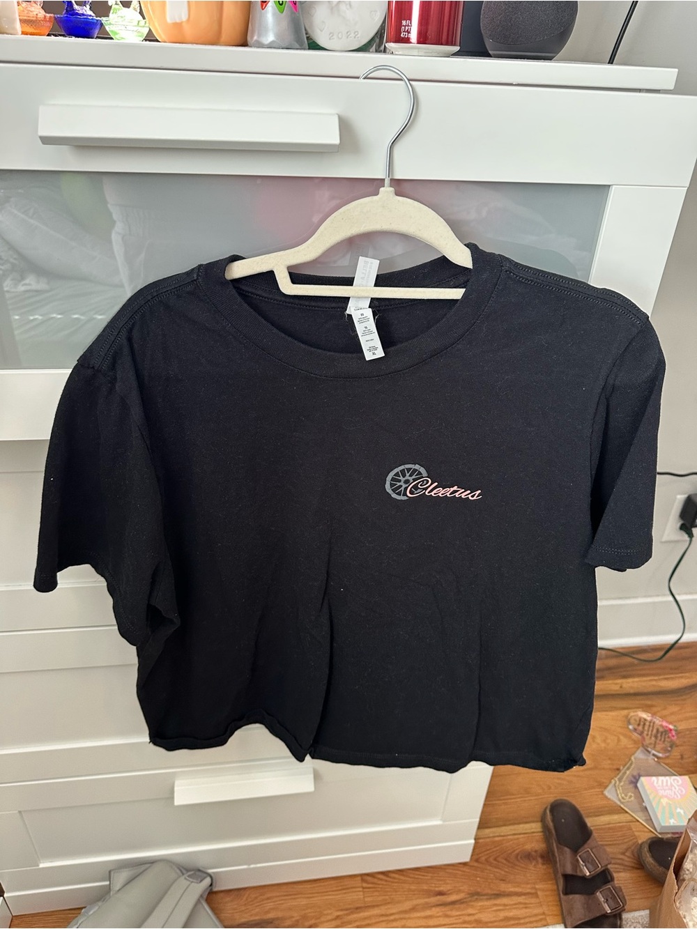 Black Cropped Tee with Pink Script and Gray Emblem
